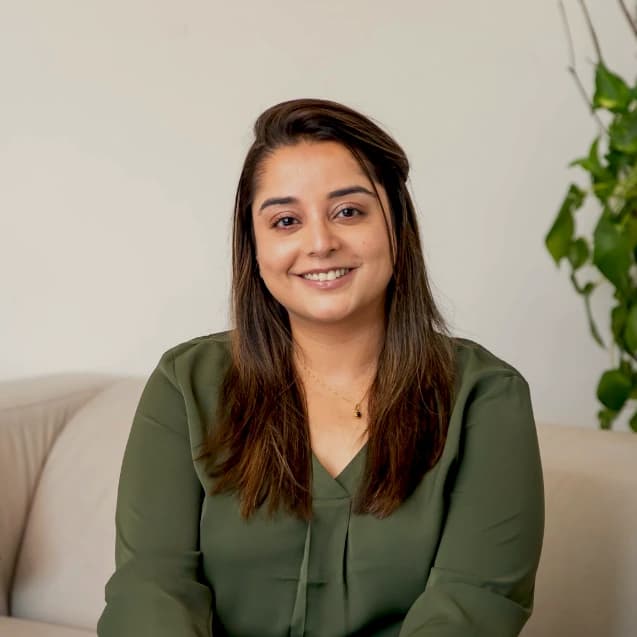 Tanya Singh, PhD, smiling in a professional setting